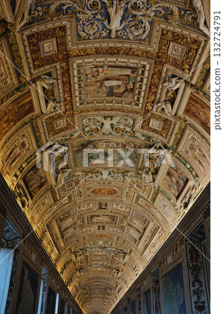 Long ornate gallery corridor with gilded vaulted ceiling crowds of visitors perspective lines Vatican Museums Rome Italy. High quality photo Long ornate gallery corridor with gilded vaulted ceiling crowds of visitors perspective lines Vatican Museums Rome Italy. High quality photo 132724791