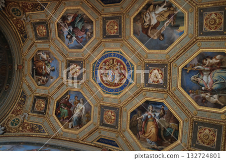 Ornate coffered ceiling blue and gold octagons with painted medallions Vatican Museums interior rich decoration symmetric pattern no people. High quality photo Ornate coffered ceiling blue and gold octagons with painted medallions Vatican Museums interior rich decoration symmetric pattern no people. High quality photo 132724801