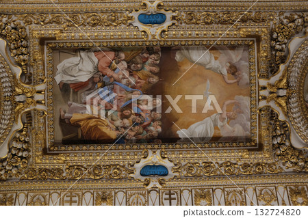 Gilded ceiling panel with roundel and framed paintings pearls and floral reliefs intricate renaissance decoration Vatican Museums close up. High quality photo 132724820