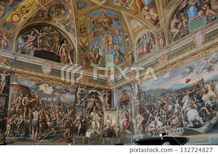 Ornate renaissance ceiling fresco with gilded coffers angels medallions and decorative borders museum interior Rome Italy cultural heritage rich colors no people vertical composition. High quality Ornate renaissance ceiling fresco with gilded coffers angels medallions and decorative borders museum interior Rome Italy cultural heritage rich colors no people vertical composition. High quality 132724827