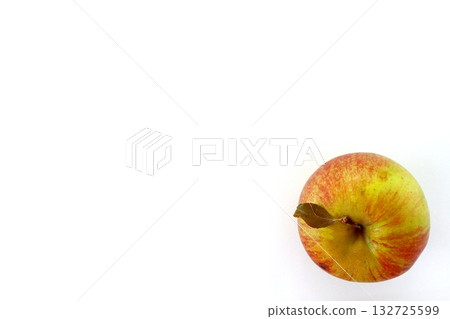 A top view of an unrelated apple on a white background A top view of an unrelated apple on a white background 132725599