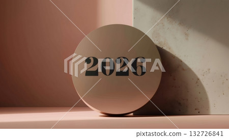 Beige circle featuring the number 2026 in bold black, leaning elegantly against a soft beige corner, casting light and shadow on a gentle pink background, symbolizing the future and new beginnings 132726841