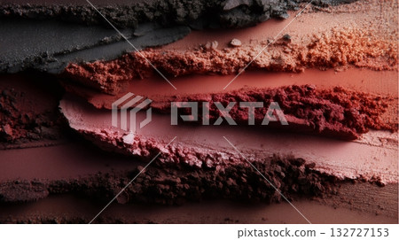 Crushed eyeshadow makeup in various shades of red, pink and brown is arranged in textured stripes, creating an abstract and colorful background ideal for beauty and cosmetics themes Crushed eyeshadow makeup in various shades of red, pink and brown is arranged in textured stripes, creating an abstract and colorful background ideal for beauty and cosmetics themes 132727153