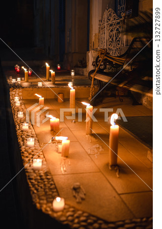 Numerous candles glow on the ancient walls of Birgu during the Birgu by Candlelight festival, creating a warm and magical ambiance 132727899
