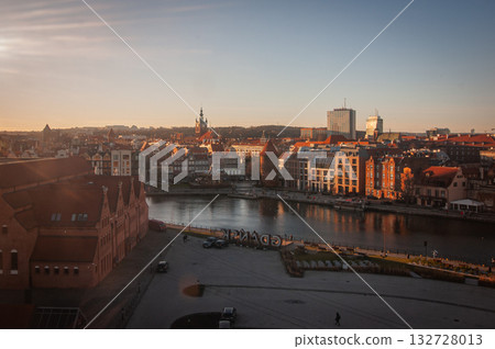 Beautiful sunset over the old town of Gdansk with City Hall and St. Mary Basilica, Poland. High quality photo 132728013
