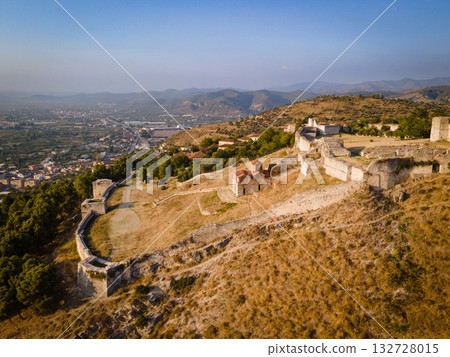 Aerial view of the old Castle of Berat and its ancient neighborhoods in sunset light, located in Albania. Photo taken with drone Aerial view of the old Castle of Berat and its ancient neighborhoods in sunset light, located in Albania. Photo taken with drone 132728015