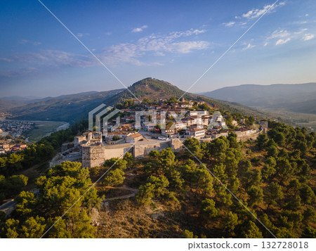 Aerial view of the old Castle of Berat and its ancient neighborhoods in sunset light, located in Albania. Photo taken with drone 132728018