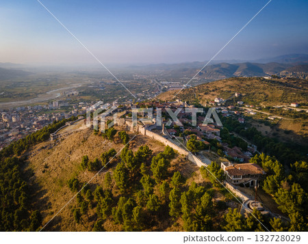 Aerial view of the old Castle of Berat and its ancient neighborhoods in sunset light, located in Albania. Photo taken with drone Aerial view of the old Castle of Berat and its ancient neighborhoods in sunset light, located in Albania. Photo taken with drone 132728029