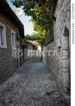 Sunset over the town of Berat on the Osum River, known for its white Ottoman houses. Also called the 'City of a Thousand Windows,' it is built against the hillside below the citadel. Sunset over the town of Berat on the Osum River, known for its white Ottoman houses. Also called the 'City of a Thousand Windows,' it is built against the hillside below the citadel. 132728048