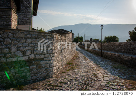 Sunset over the town of Berat on the Osum River, known for its white Ottoman houses. Also called the 'City of a Thousand Windows,' it is built against the hillside below the citadel. 132728070