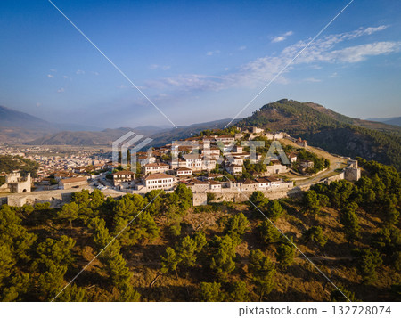 Aerial view of the old Castle of Berat and its ancient neighborhoods in sunset light, located in Albania. Photo taken with drone Aerial view of the old Castle of Berat and its ancient neighborhoods in sunset light, located in Albania. Photo taken with drone 132728074