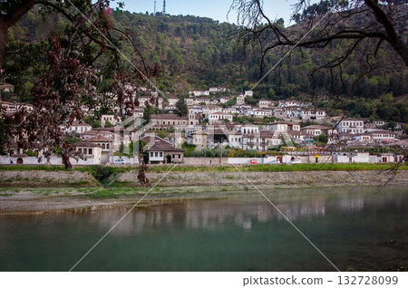 Sunset over the town of Berat on the Osum River, known for its white Ottoman houses. Also called the 'City of a Thousand Windows,' it is built against the hillside below the citadel. 132728099