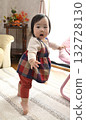 Baby walking along 132728130