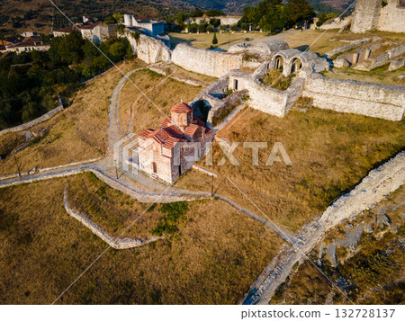 Aerial view of the old Castle of Berat and its ancient neighborhoods in sunset light, located in Albania. Photo taken with drone Aerial view of the old Castle of Berat and its ancient neighborhoods in sunset light, located in Albania. Photo taken with drone 132728137