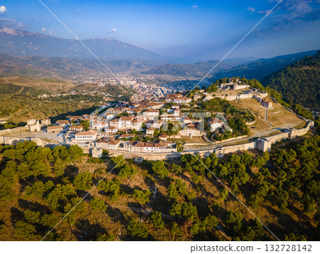 Aerial view of the old Castle of Berat and its ancient neighborhoods in sunset light, located in Albania. Photo taken with drone Aerial view of the old Castle of Berat and its ancient neighborhoods in sunset light, located in Albania. Photo taken with drone 132728142