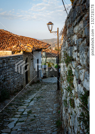 Sunset over the town of Berat on the Osum River, known for its white Ottoman houses. Also called the 'City of a Thousand Windows,' it is built against the hillside below the citadel. 132728178