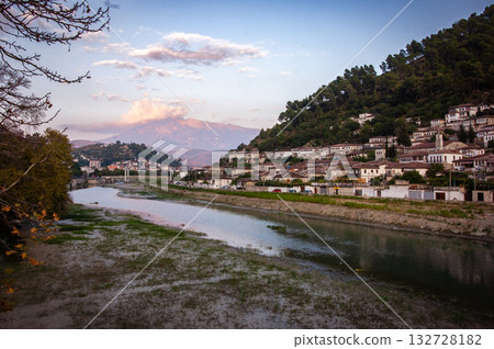 Sunset over the town of Berat on the Osum River, known for its white Ottoman houses. Also called the 'City of a Thousand Windows,' it is built against the hillside below the citadel. 132728182