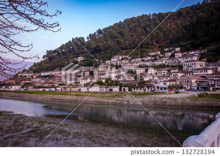 Sunset over the town of Berat on the Osum River, known for its white Ottoman houses. Also called the 'City of a Thousand Windows,' it is built against the hillside below the citadel. 132728194
