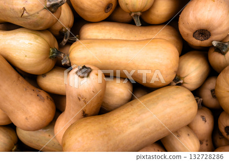 Close-up pile of pumpkins Fresh orange pumpkins stacked tightly, perfect seasonal harvest background for autumn and Halloween. Close-up pile of pumpkins Fresh orange pumpkins stacked tightly, perfect seasonal harvest background for autumn and Halloween. 132728286