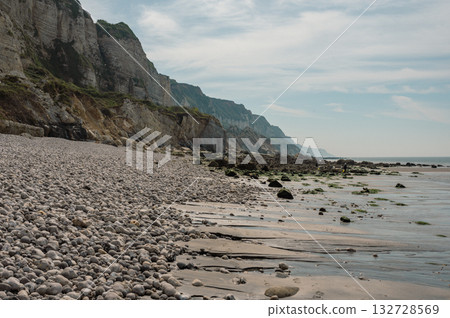 A peaceful river winds its way toward the open sea, blending freshwater with saltwater in a serene coastal landscape. A peaceful river winds its way toward the open sea, blending freshwater with saltwater in a serene coastal landscape. 132728569