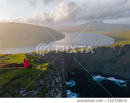 Scenic viewpoint on Traelanipa trail, overlooking dramatic basalt cliffs and vast volcanic rock formations above the ocean. Scenic viewpoint on Traelanipa trail, overlooking dramatic basalt cliffs and vast volcanic rock formations above the ocean. 132728618