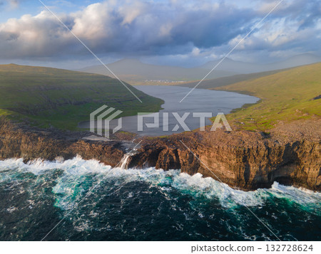 Scenic viewpoint on Traelanipa trail, overlooking dramatic basalt cliffs and vast volcanic rock formations above the ocean. Scenic viewpoint on Traelanipa trail, overlooking dramatic basalt cliffs and vast volcanic rock formations above the ocean. 132728624