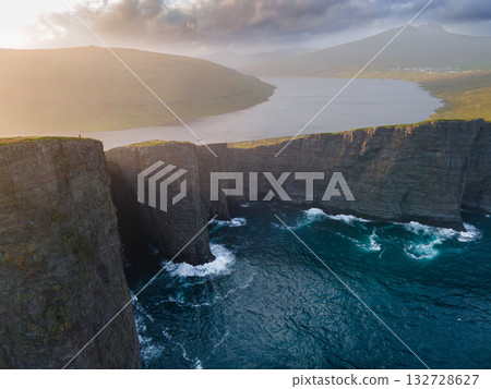 Scenic viewpoint on Traelanipa trail, overlooking dramatic basalt cliffs and vast volcanic rock formations above the ocean. 132728627