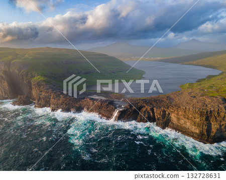 Scenic viewpoint on Traelanipa trail, overlooking dramatic basalt cliffs and vast volcanic rock formations above the ocean. Scenic viewpoint on Traelanipa trail, overlooking dramatic basalt cliffs and vast volcanic rock formations above the ocean. 132728631