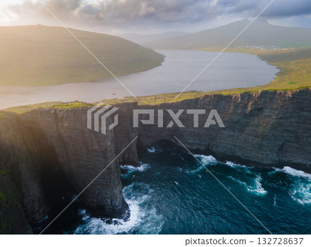 Scenic viewpoint on Traelanipa trail, overlooking dramatic basalt cliffs and vast volcanic rock formations above the ocean. 132728637