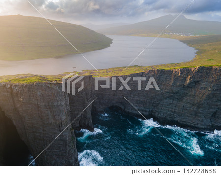 Scenic viewpoint on Traelanipa trail, overlooking dramatic basalt cliffs and vast volcanic rock formations above the ocean. Scenic viewpoint on Traelanipa trail, overlooking dramatic basalt cliffs and vast volcanic rock formations above the ocean. 132728638