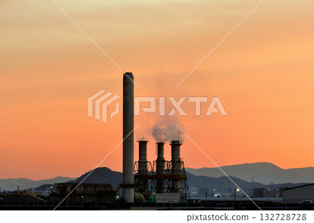 Orange clouds spreading across the sky above Samukawa Industrial Park 132728728