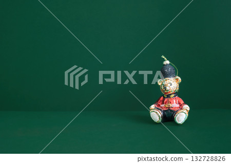 Festive dark green Christmas background decorated with ornaments, baubles, and holiday lights, creating a cozy seasonal atmosphere. 132728826