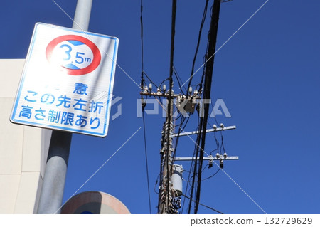 Patterns made by power lines and a clear sky 132729629