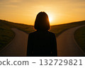 A woman at a crossroads in life, facing a fork in the road 132729821