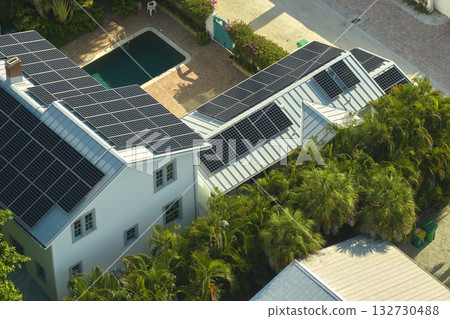 Aerial view of new expensive american home roof with blue solar photovoltaic panels for producing clean ecological electric energy. Renewable electricity with zero emission concept 132730488