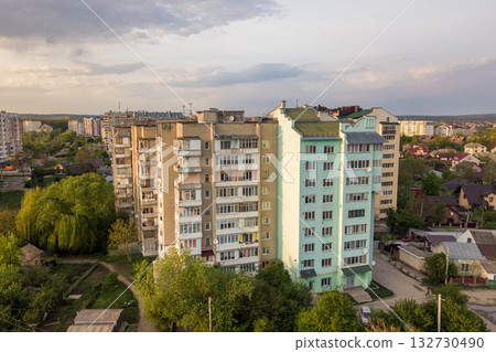Aerial view of multistory apartment buildings in green residential area. Aerial view of multistory apartment buildings in green residential area. 132730490