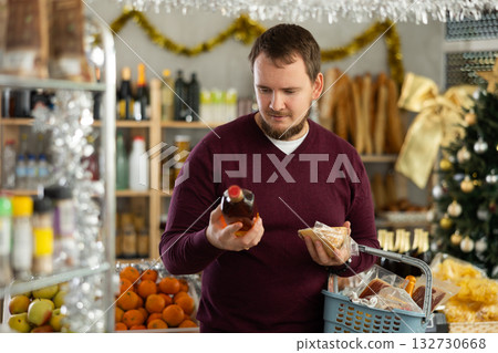 Man chooses whiskey and cheese Man chooses whiskey and cheese 132730668