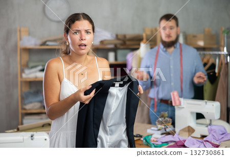 Female client dissatisfied with quality of custom blazer 132730861