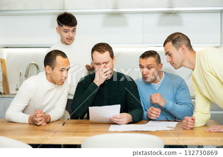 Friends comforting upset man receiving unpleasant news Friends comforting upset man receiving unpleasant news 132730869