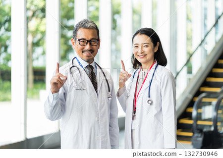 Middle-aged and senior male and female medical professionals. Middle-aged and senior male and female medical professionals. 132730946