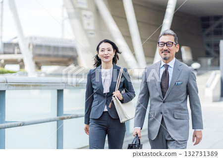 Middle-aged and senior business people, both male and female. Middle-aged and senior business people, both male and female. 132731389