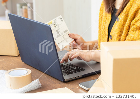 Hands typing in slips Hands typing in slips 132731403