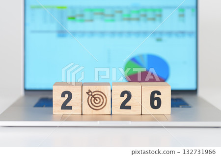 2026 Year block with dartboard icon against computer laptop background. Goal, Target, Resolution, strategy, plan, Action, mission, motivation, and New Year start concepts 132731966