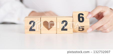 2025 end year to Happy New Year 2026 with heart block for health care, love, organ donation, resolution, charity, happy family, wellbeing and insurance concepts 132732007