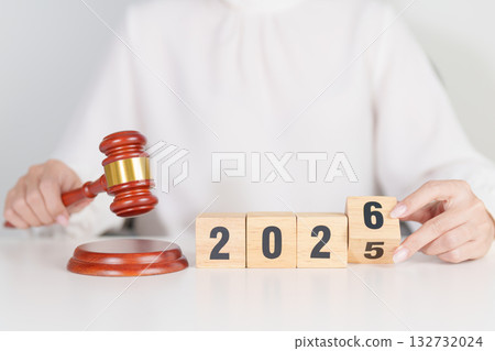 2025 end year to Happy New Year 2026 with judge gavel on table. Law, lawyer, judgment, justice auction and bidding concept 132732024