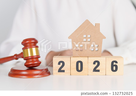 Happy New Year 2026 with small toy house model with gavel justice hammer on desk in courthouse. Real Estate Law, Home Insurance, property Tax, Auction and Bidding concepts Happy New Year 2026 with small toy house model with gavel justice hammer on desk in courthouse. Real Estate Law, Home Insurance, property Tax, Auction and Bidding concepts 132732025
