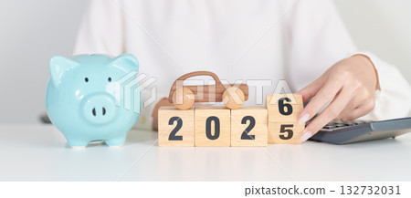 2025 end year to Happy New Year 2026 with car model and Coins Money stack for deposit and Automobile Tax. Money Saving, Car Insurance, Financial, vehicle Repair and Maintenance and New Year concept 132732031
