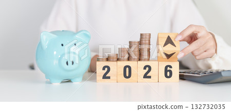 2026 New year with change to UP and Down arrow with coin stack. Interest rate, GDP, stocks market, financial, deflation and Inflation, mortgage, debt, Loan and Economic Recession 132732035