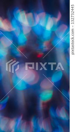 Blur lens leak. Flare blend. Blue green red neon light mix color. Faceted circle prism shimmering reflection texture abstract dark background. 132732445