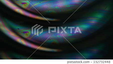 Defocused gasoline acid. Light liquid. Purple blue neon colorful ink droplet bubbles flow curve texture floating on abstract dark black background. 132732448